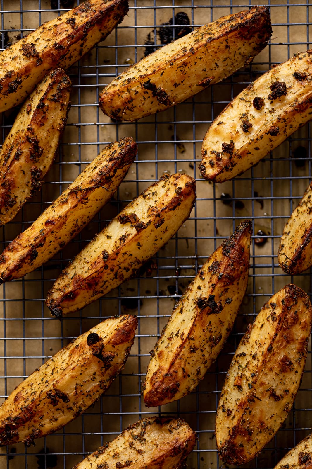 Crispy Jumbo Garlic Herb Fries on a wire rack