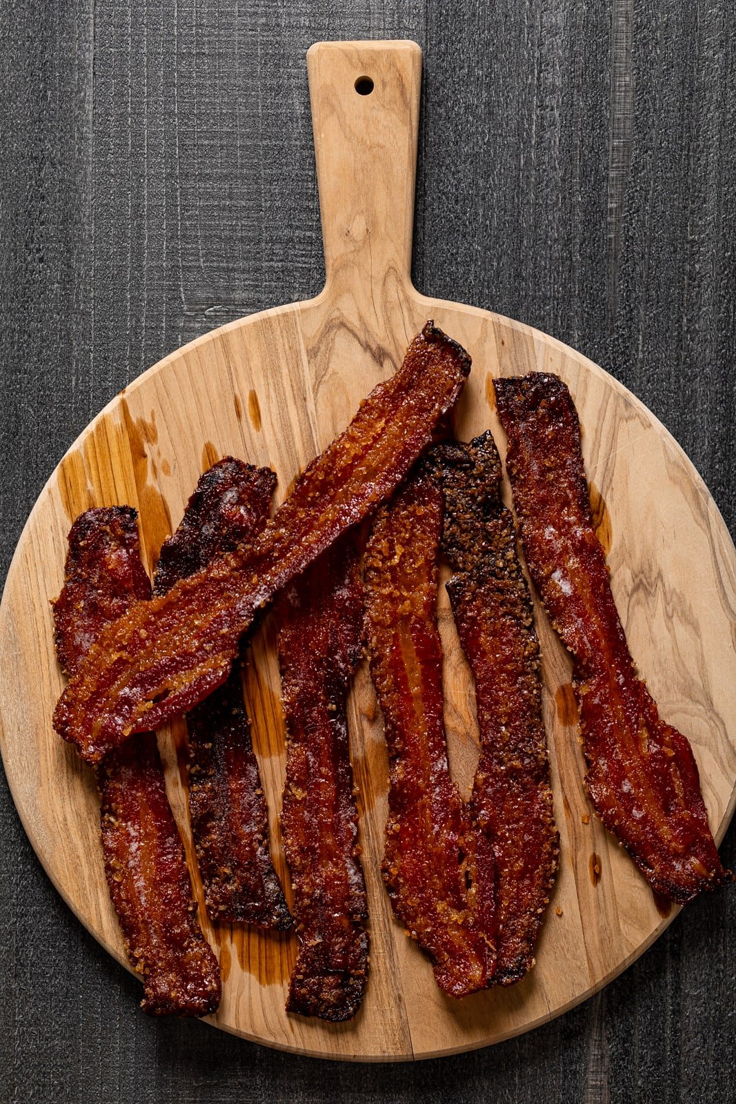 Cooked bacon on a wooden board