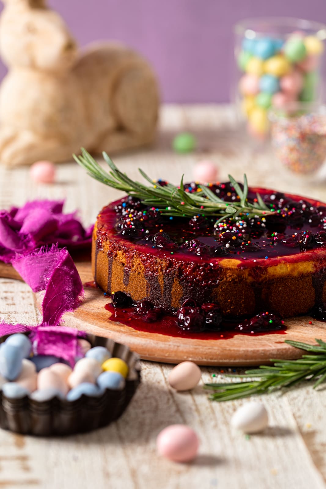 Lemon Blueberry Cheesecake topped with sprigs of rosemary