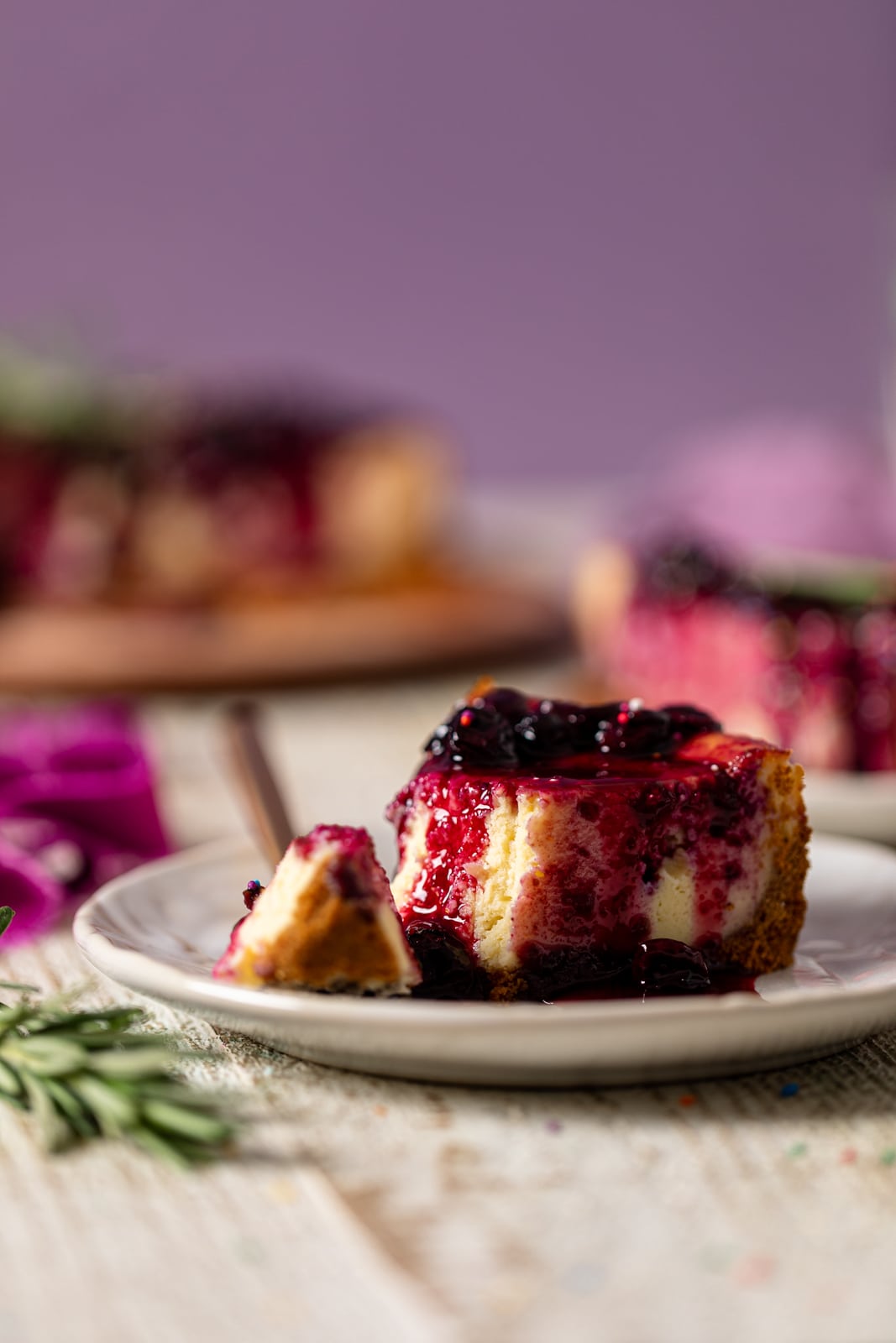 Slice of Lemon Blueberry Cheesecake on a plate
