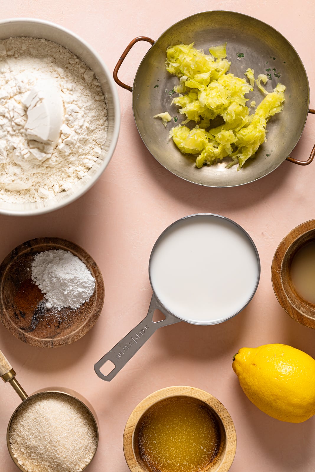 Ingredients for Vegan Lemon Zucchini Bread including lemons, almond milk, and sugar