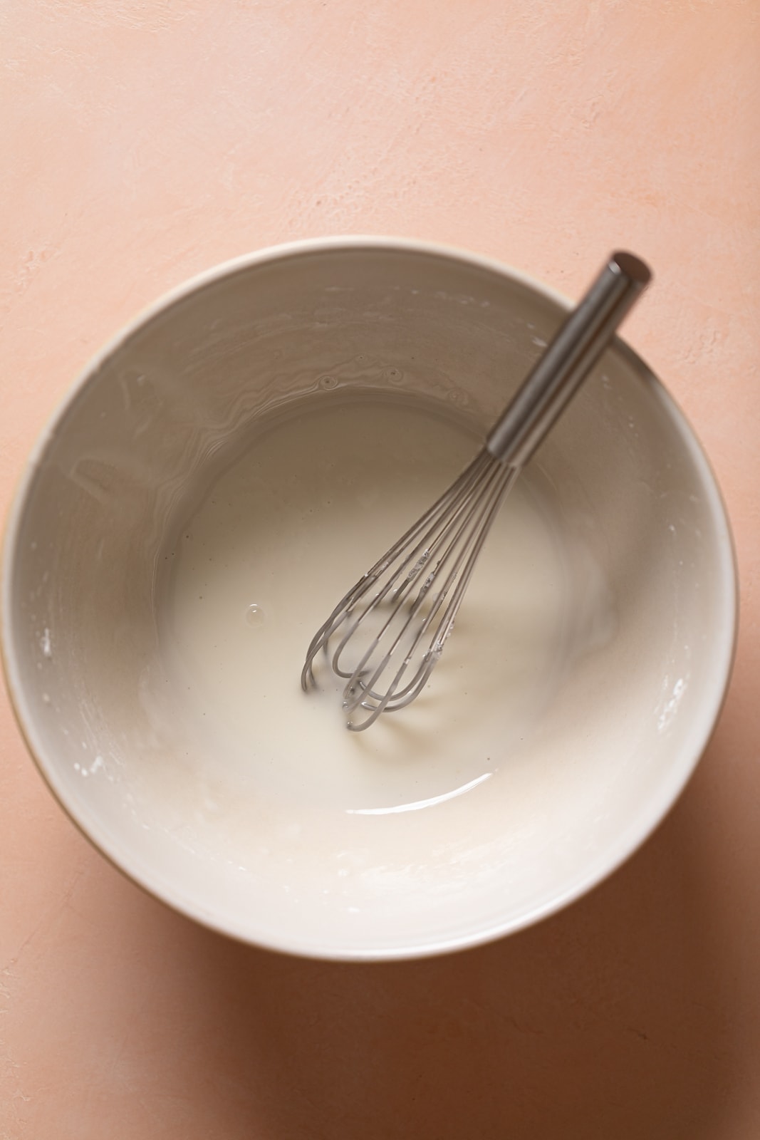 Whisk in a bowl of lemon glaze