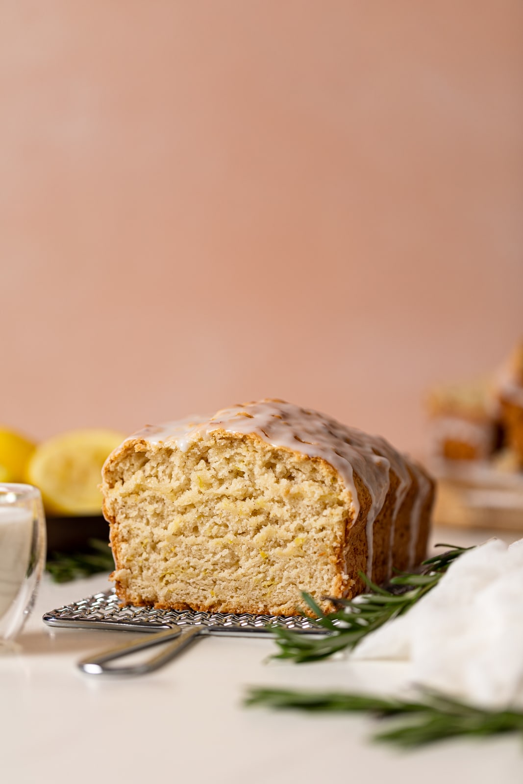 Loaf of Vegan Lemon Zucchini Bread on a wire rack