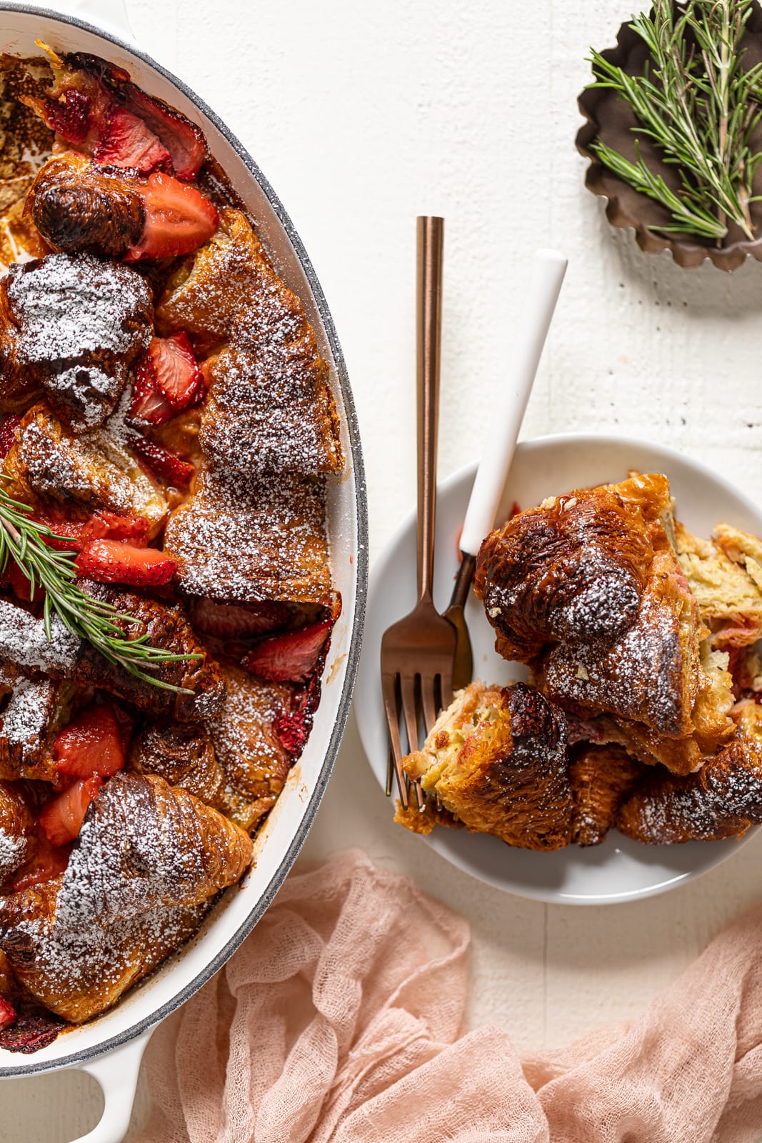 Plate and pan of Baked Strawberry Croissant French Toast