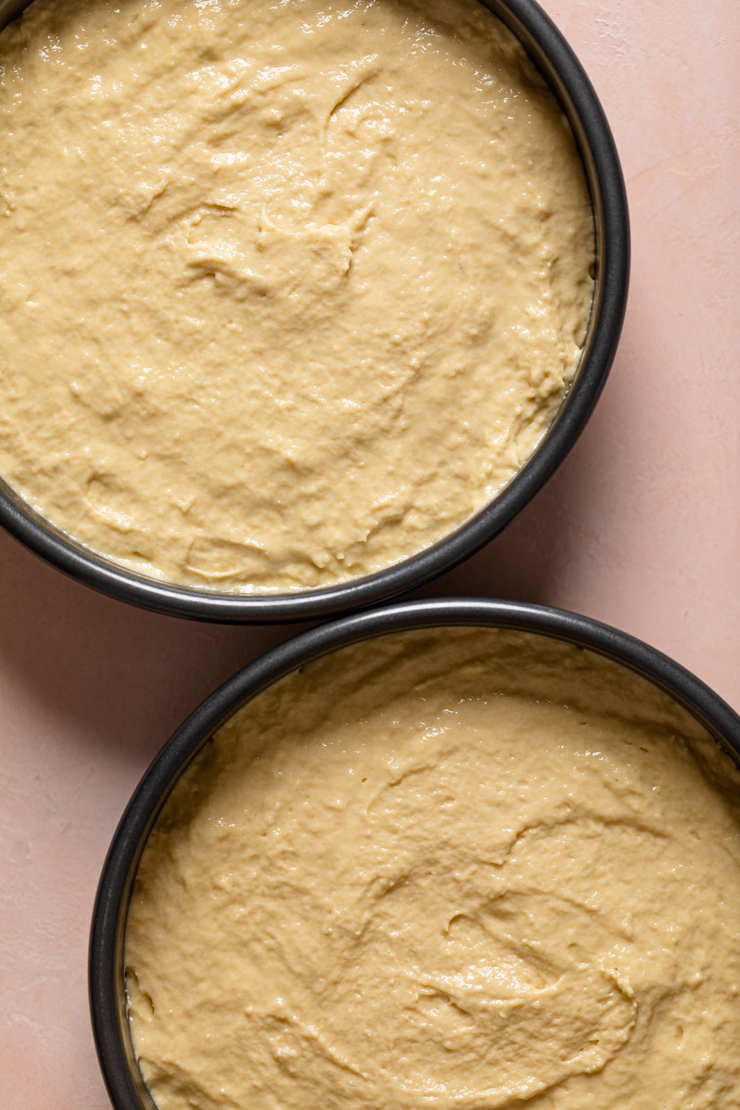 Two round pans of Vanilla Yogurt Cake batter