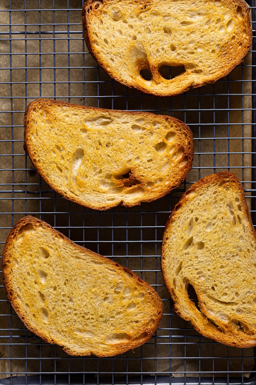 Toasted bread slices on a wire rack