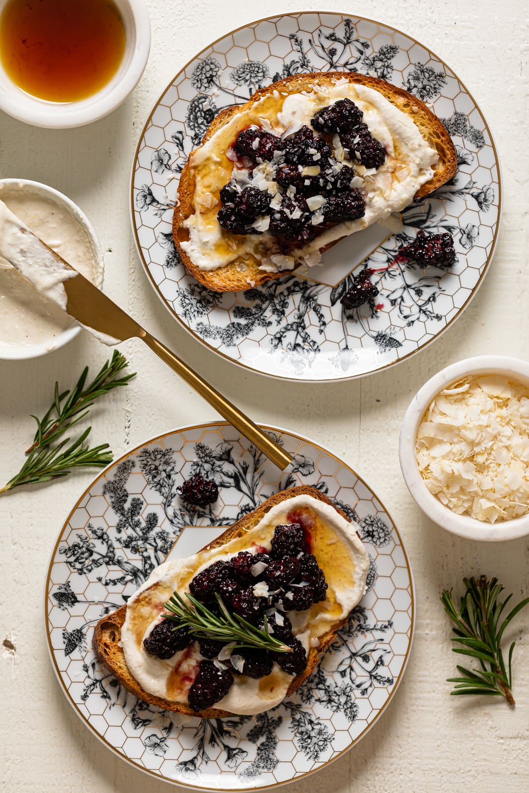 Two plates of Vegan Lemon Cream Cheese Breakfast Toast with Roasted Blackberries