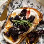 Vegan Lemon Cream Cheese Breakfast Toast with Roasted Blackberries on a plate