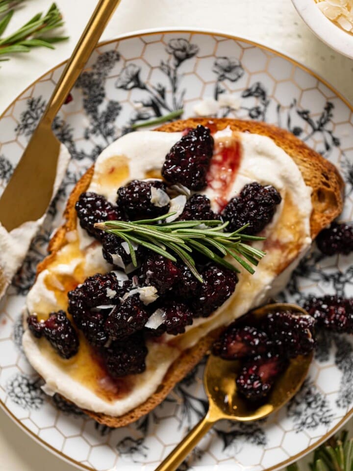 Vegan Lemon Cream Cheese Breakfast Toast with Roasted Blackberries on a plate