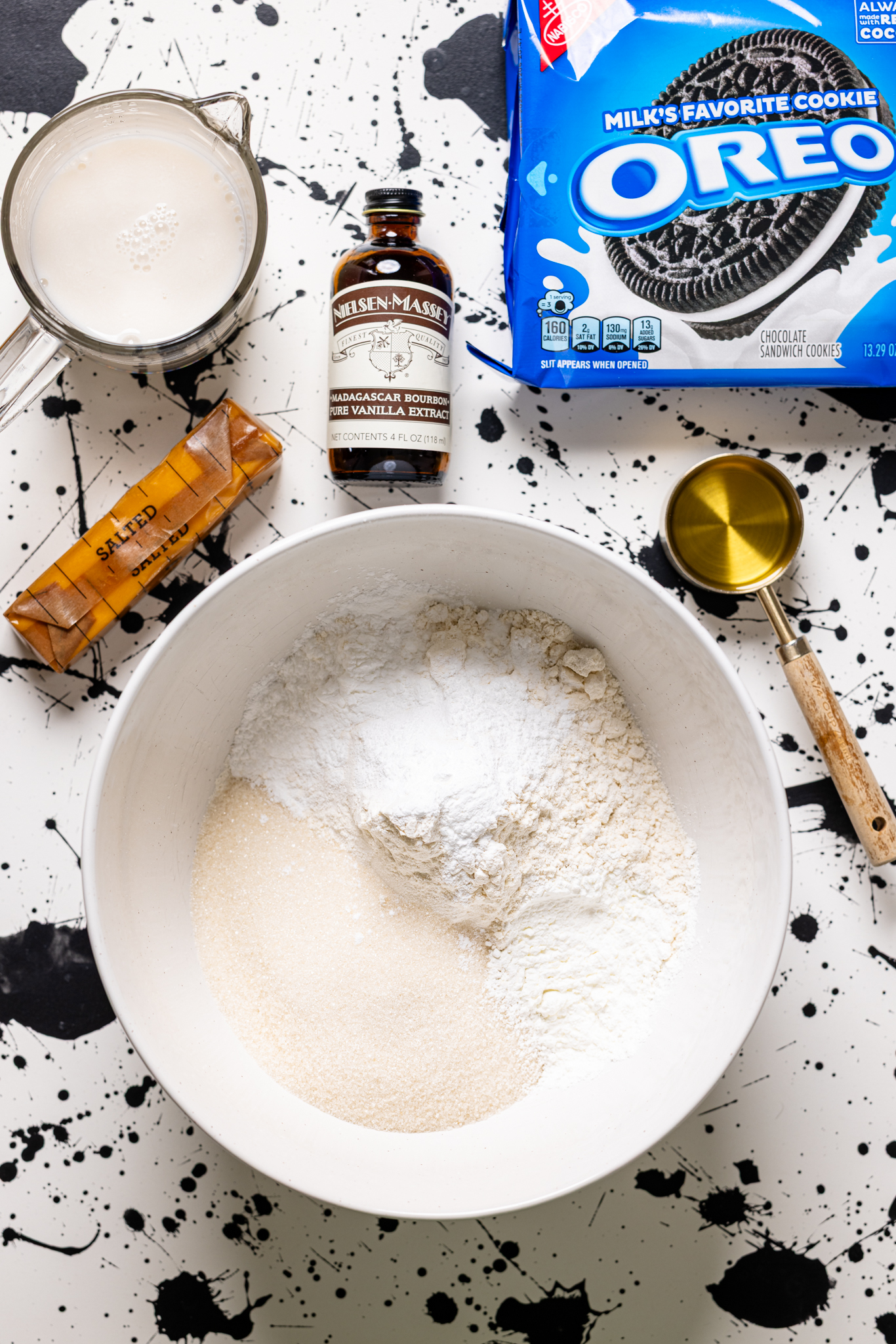 Ingredients on a white and black table.