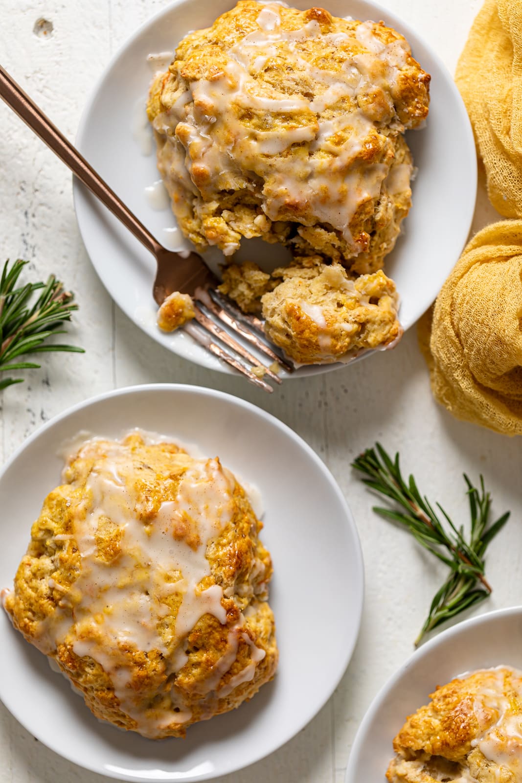 Two Banana Carrot Cake Scones on two separate plates