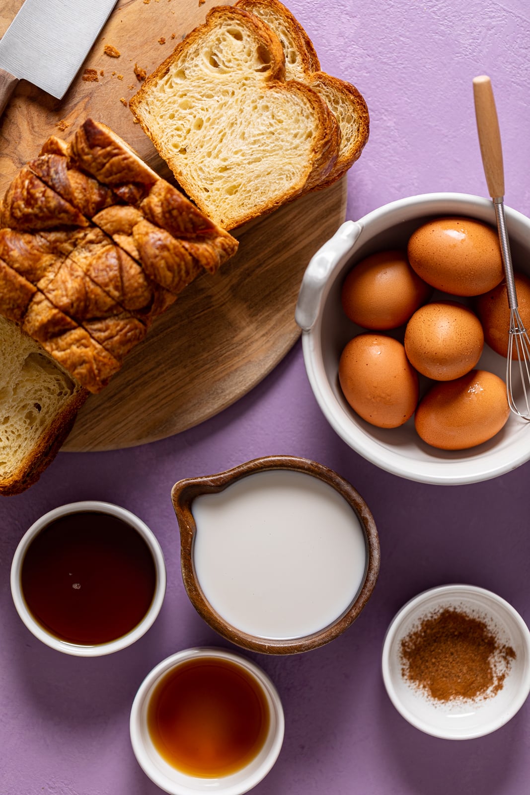 Ingredients for Blueberry Pie French Toast Casserole including eggs, sliced bread, and cinnamon