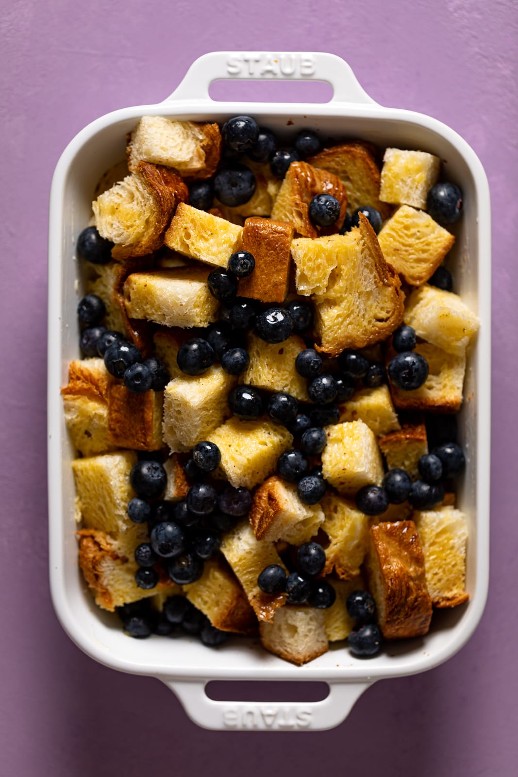 Uncooked baking pan of Blueberry Pie French Toast Casserole