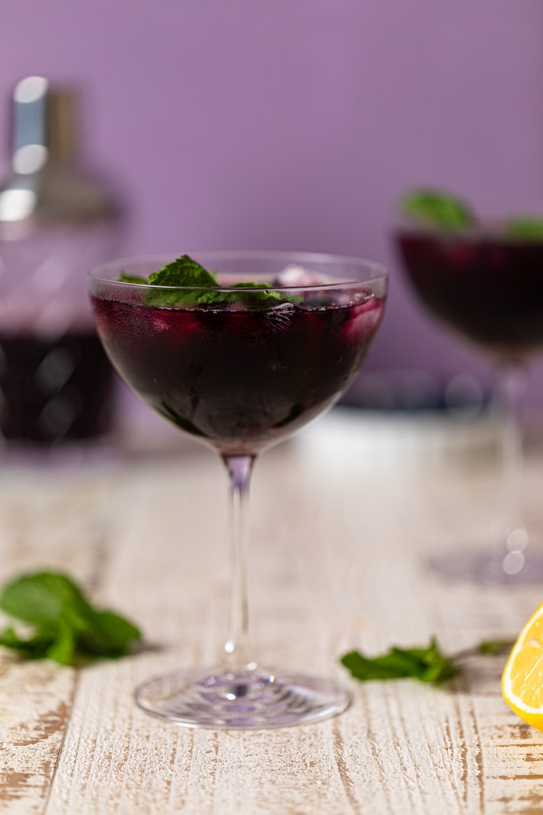 Blueberry Lavender Chamomile Mocktail in a long-stemmed glass