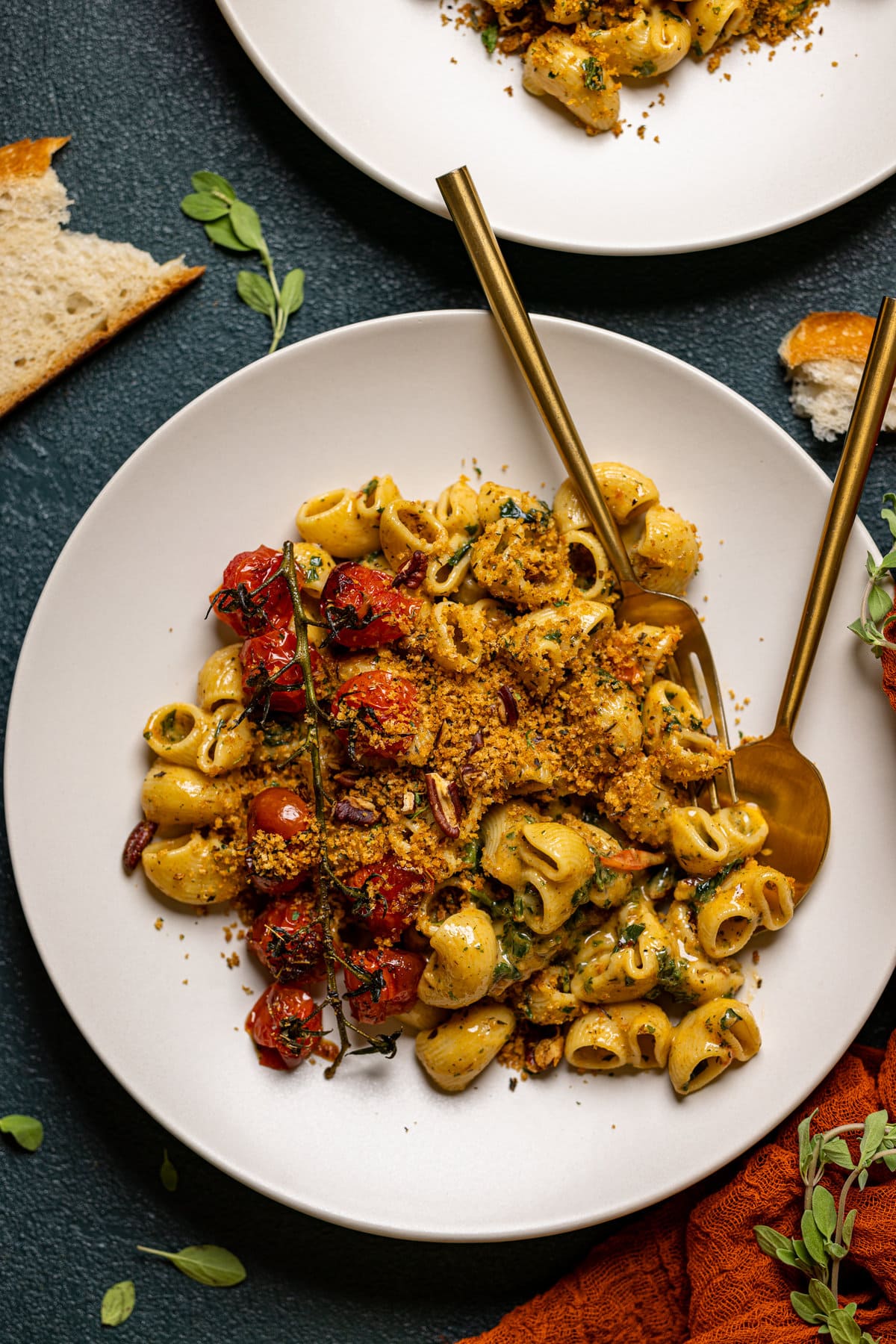 Southern-Style Cajun Pasta with Pecan Breadcrumbs on a plate with silverware