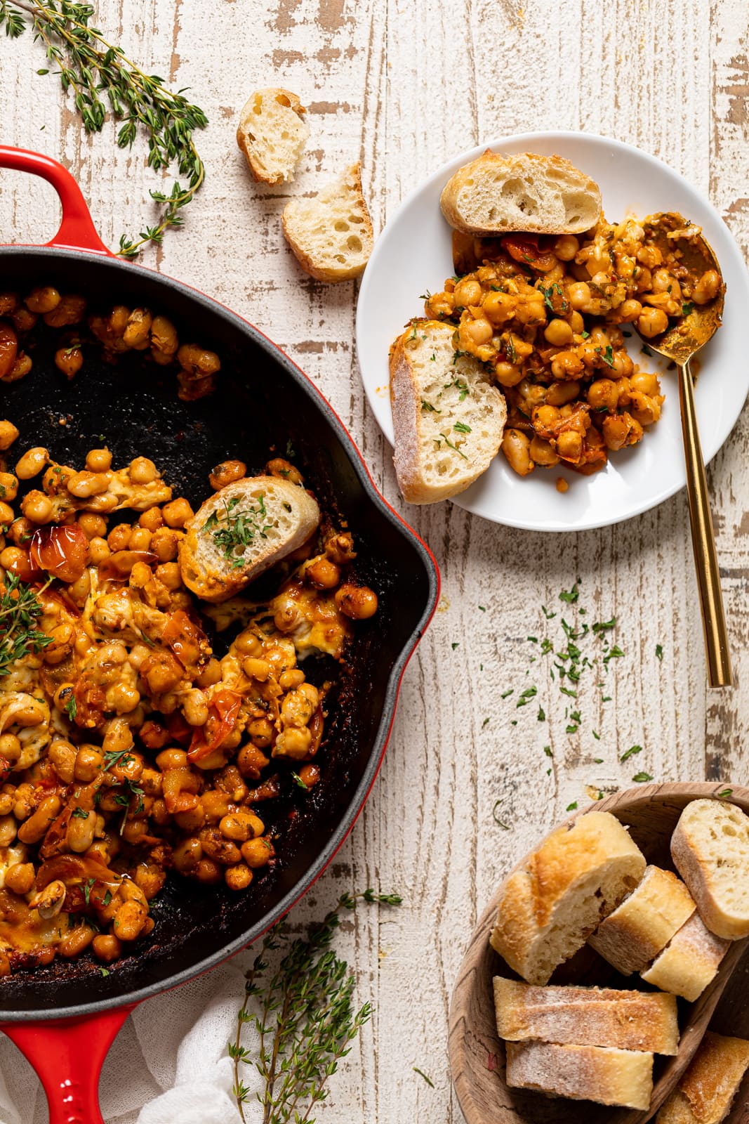 Plate and skillet of Saucy Baked Chickpea and White Beans