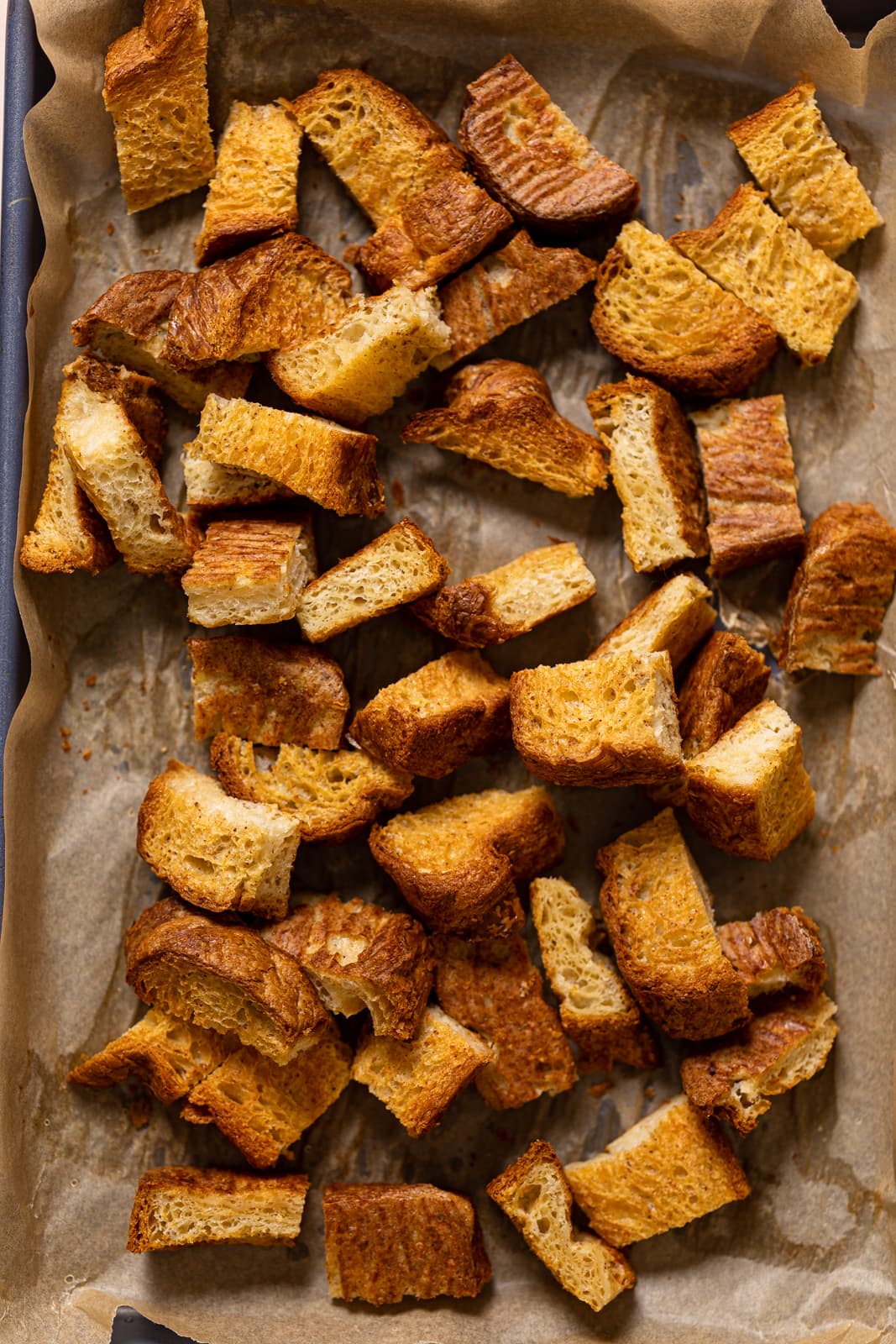 Bread pieces on a baking sheet