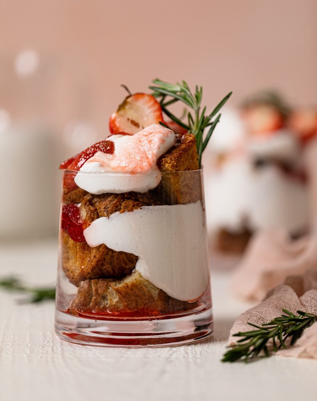 Glass overflowing with a Dairy-Free Strawberry French Toast Trifle