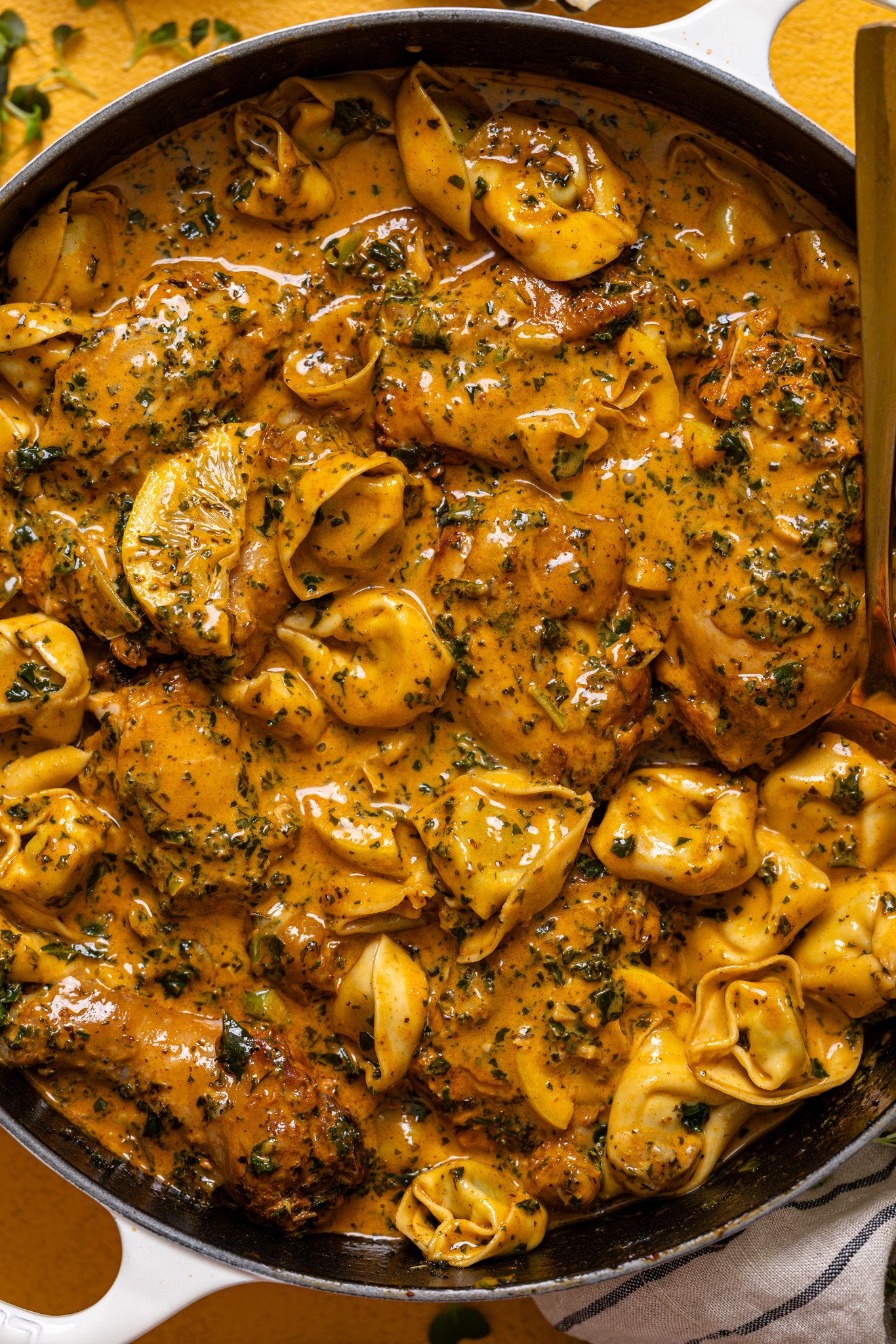 Up close shot of Creamy Lemon Garlic Herb Chicken with Tortellini.