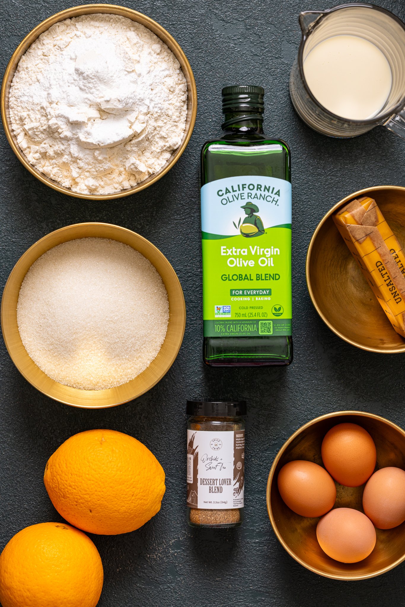 Ingredients on a hunter green table.
