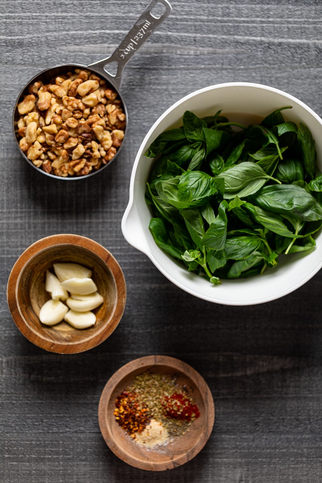 Ingredients for Walnut Pesto Bucatini Pasta including basil, garlic, and walnuts