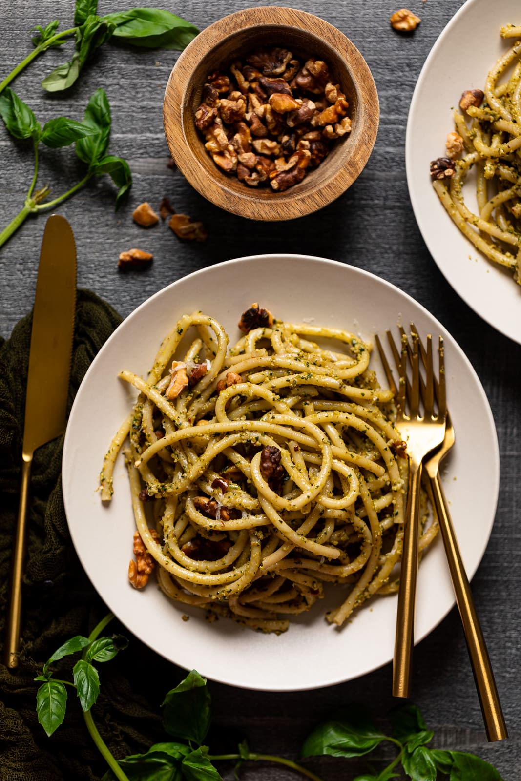 Plate of Walnut Pesto Bucatini Pasta with two forks