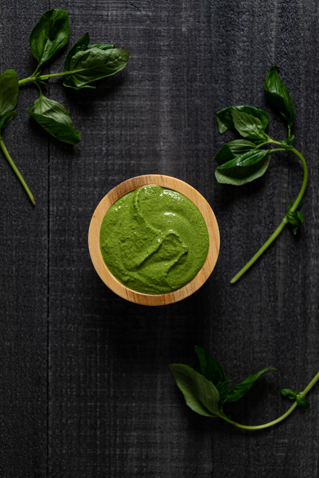 Small wooden bowl of kale pesto