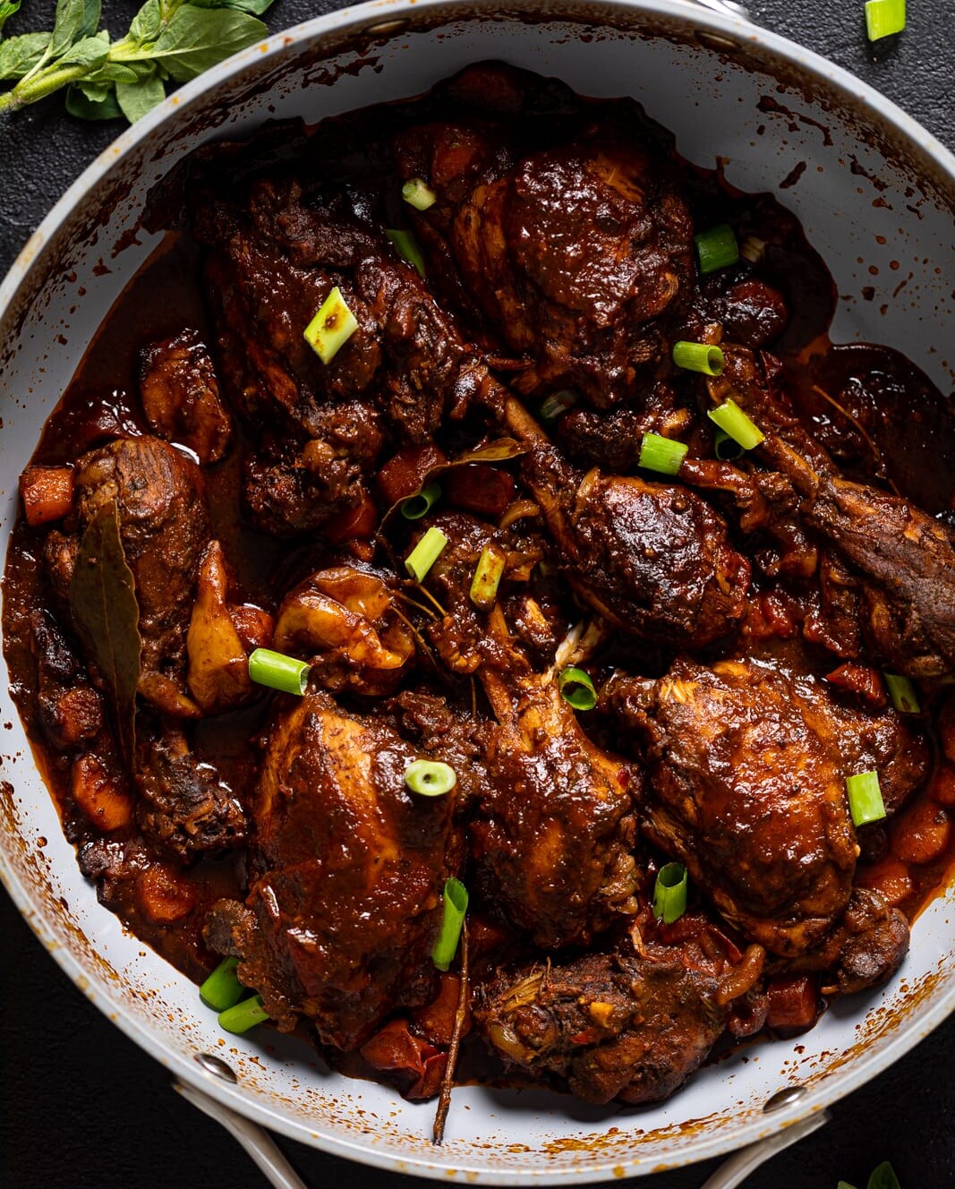 Overhead shot of a pan of Jamaican Brown Stew Chicken