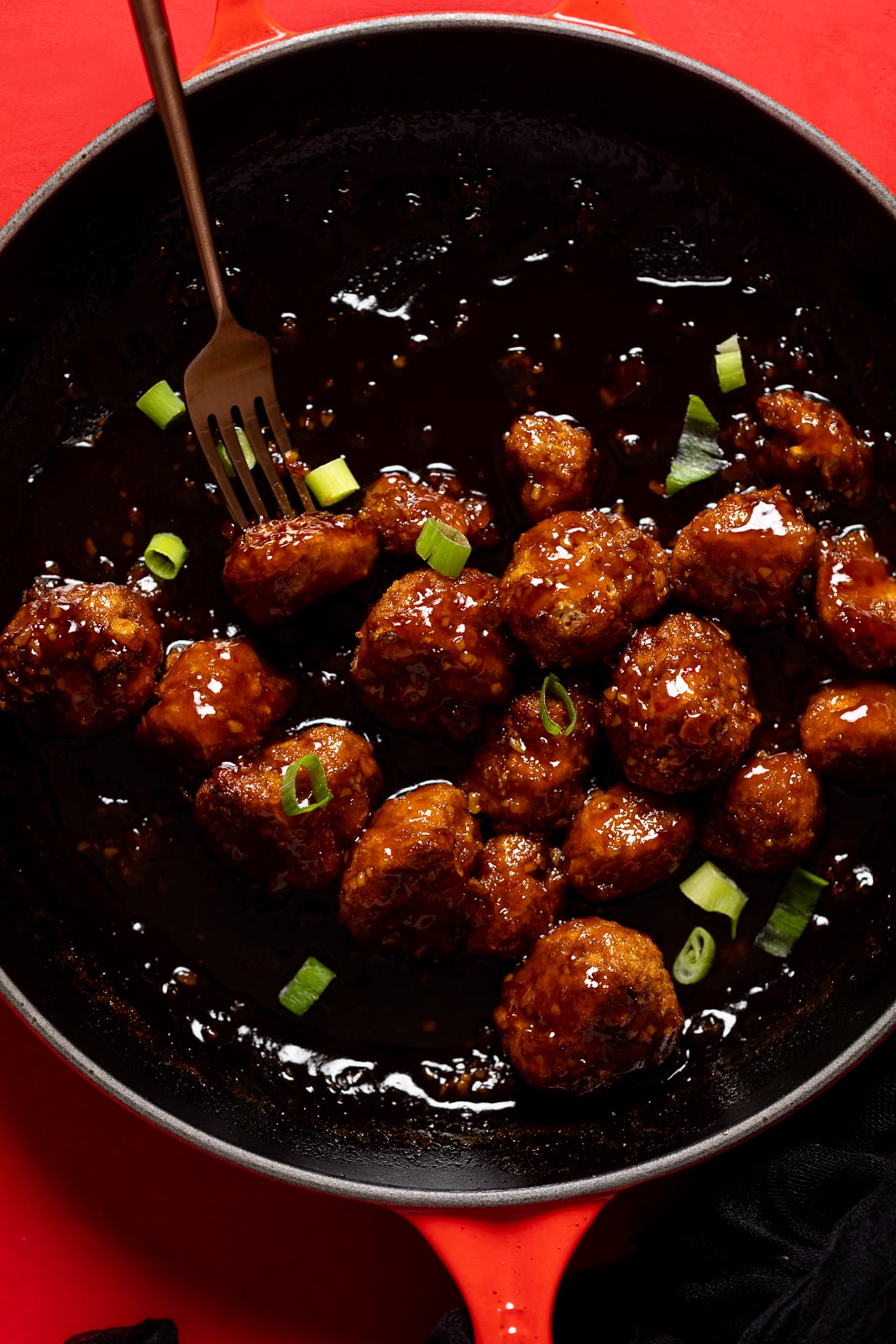 Closeup of a skillet of Sticky Coca-Cola Cauliflower Wings