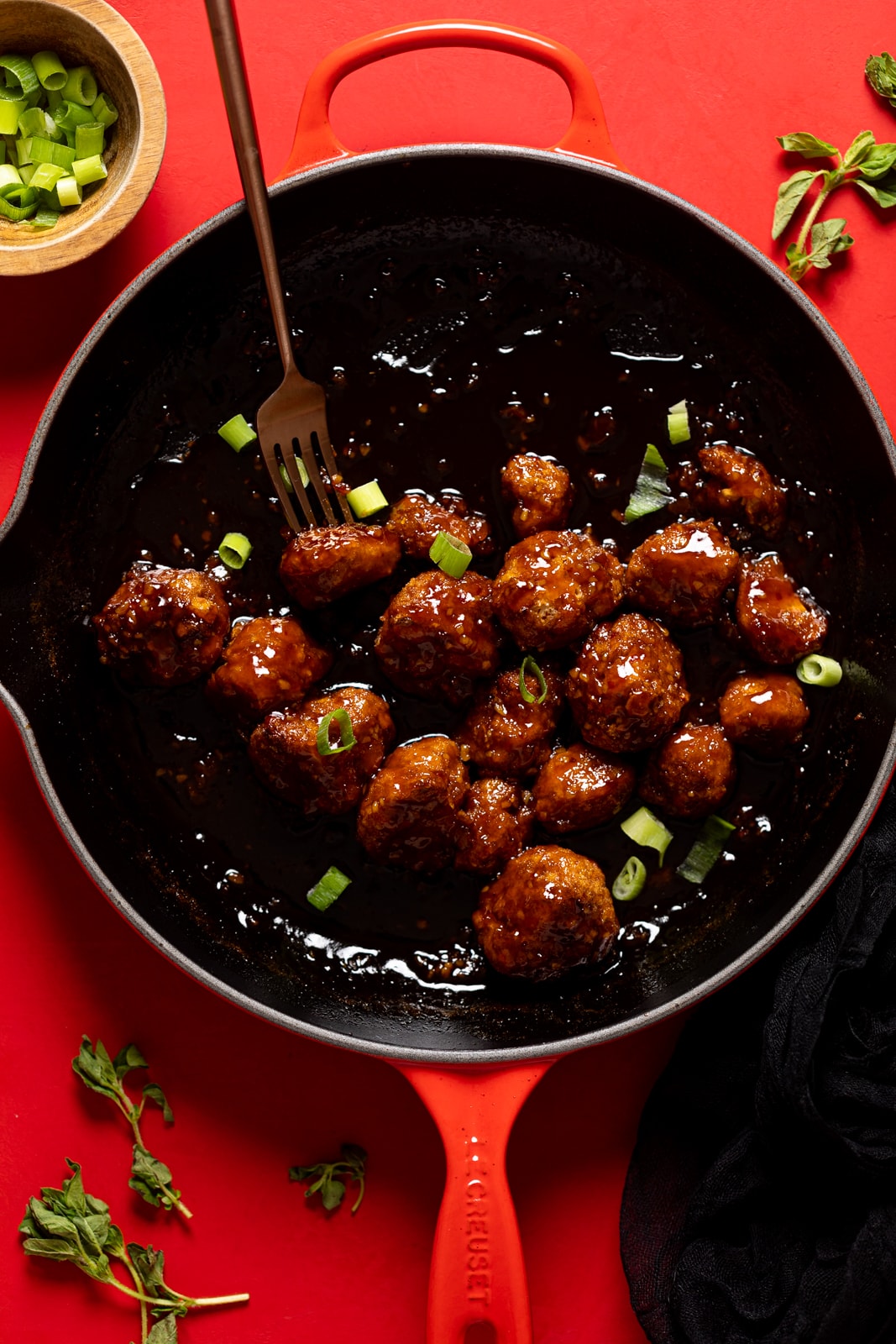 Overhead shot of a skillet of Sticky Coca-Cola Cauliflower Wings