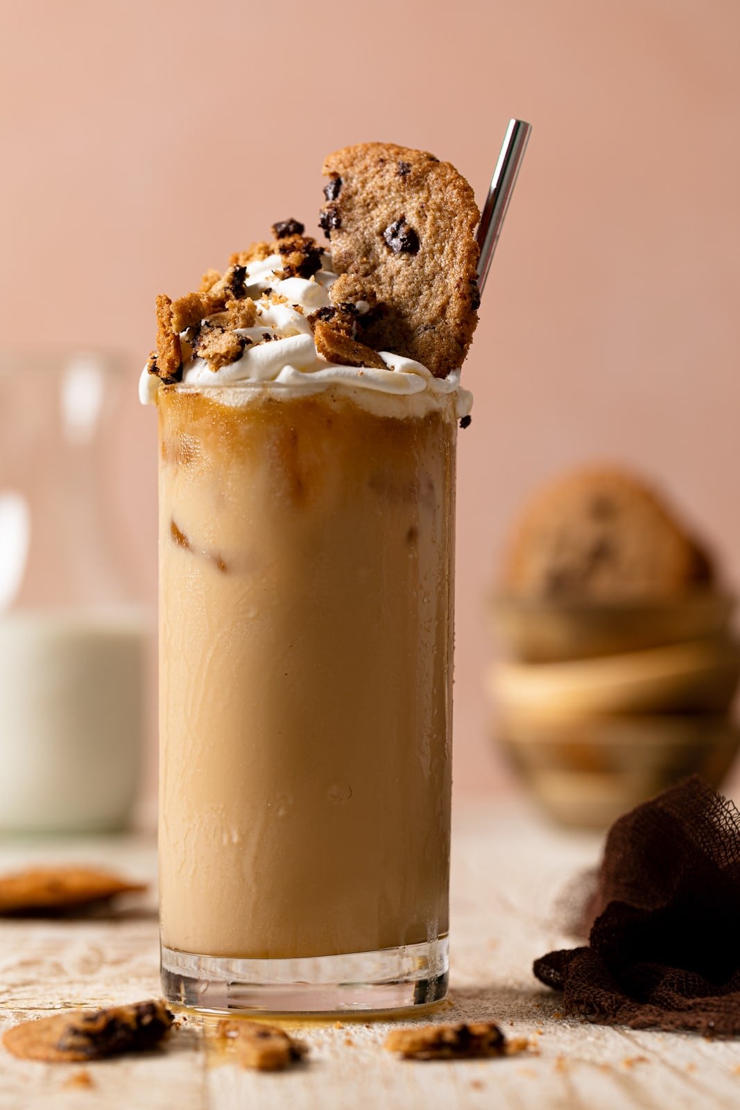 Closeup of a Brown Butter Maple Cookie Latte topped with whipped cream and cookies