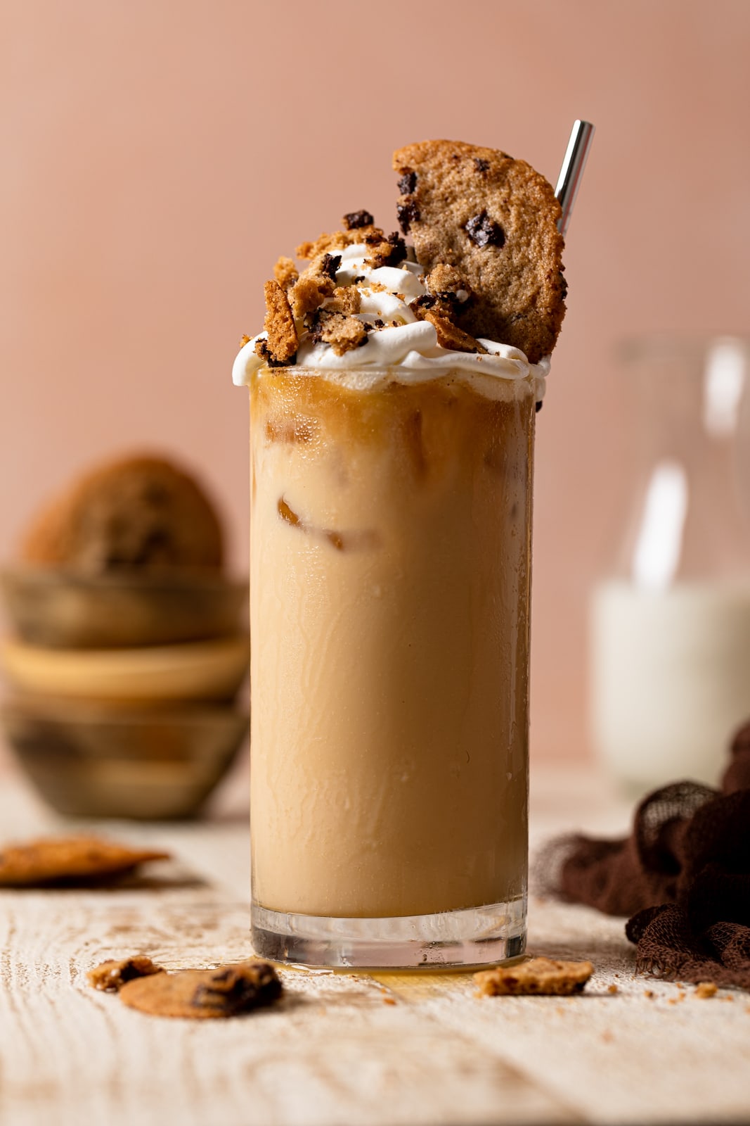 Closeup of a Brown Butter Maple Cookie Latte topped with whipped cream and cookies