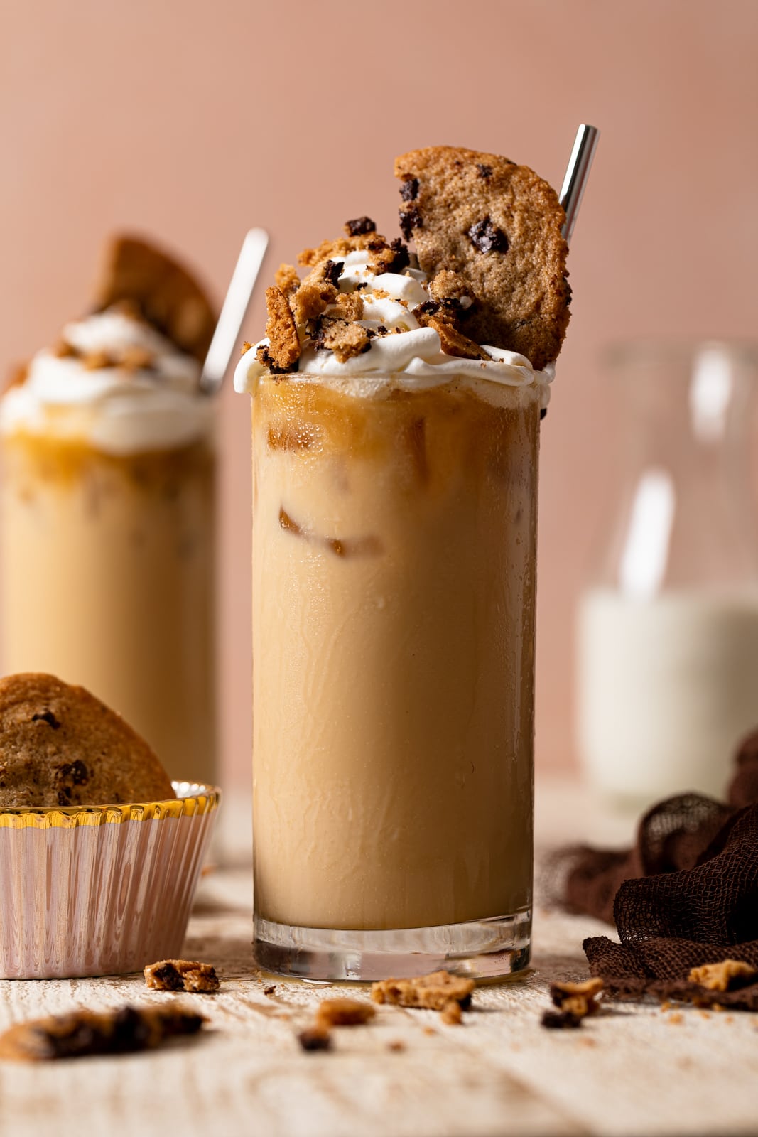 Brown Butter Maple Cookie Latte topped with whipped cream and cookies in a glass