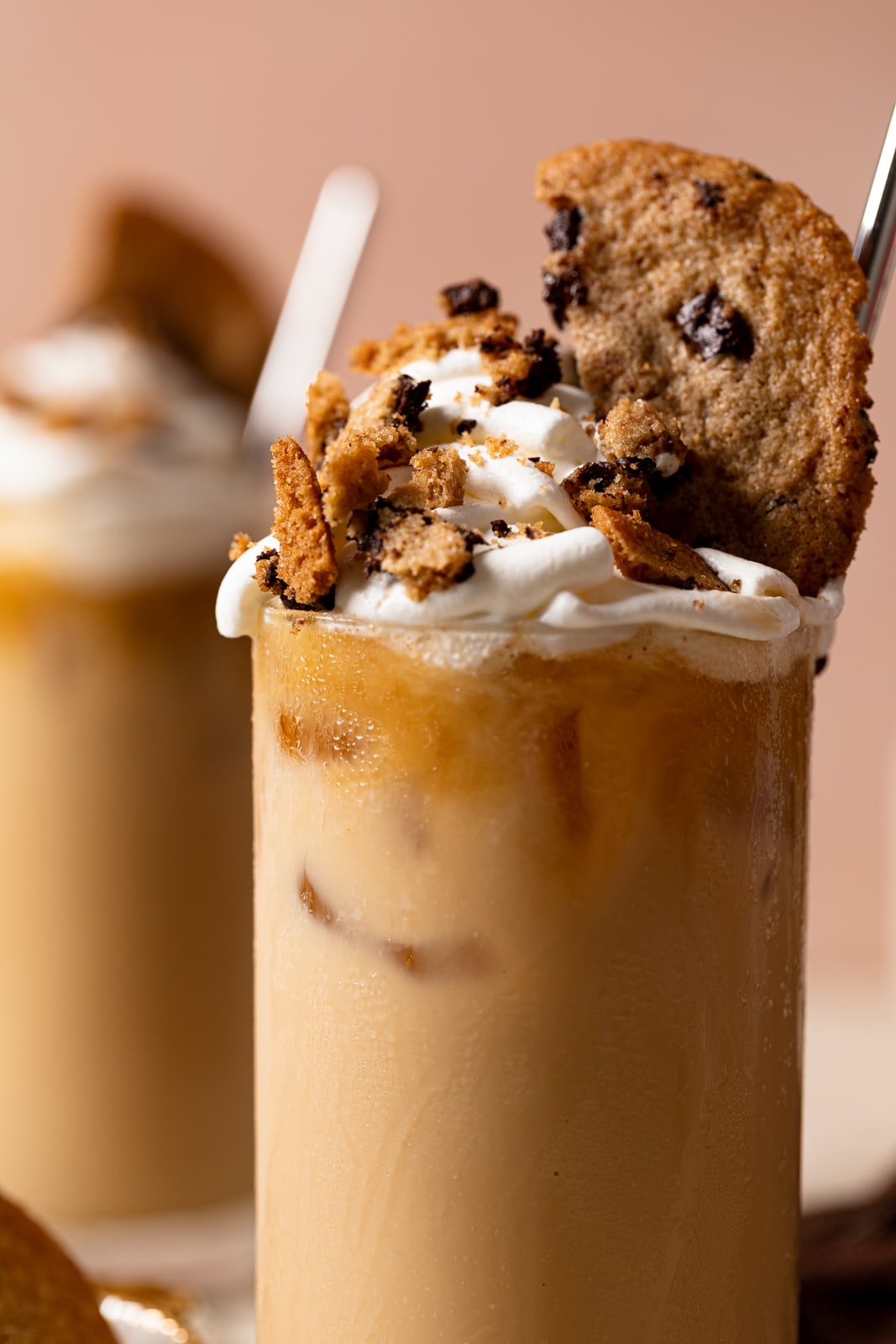 Closeup of the toppings for a Brown Butter Maple Cookie Latte including whipped cream and cookies