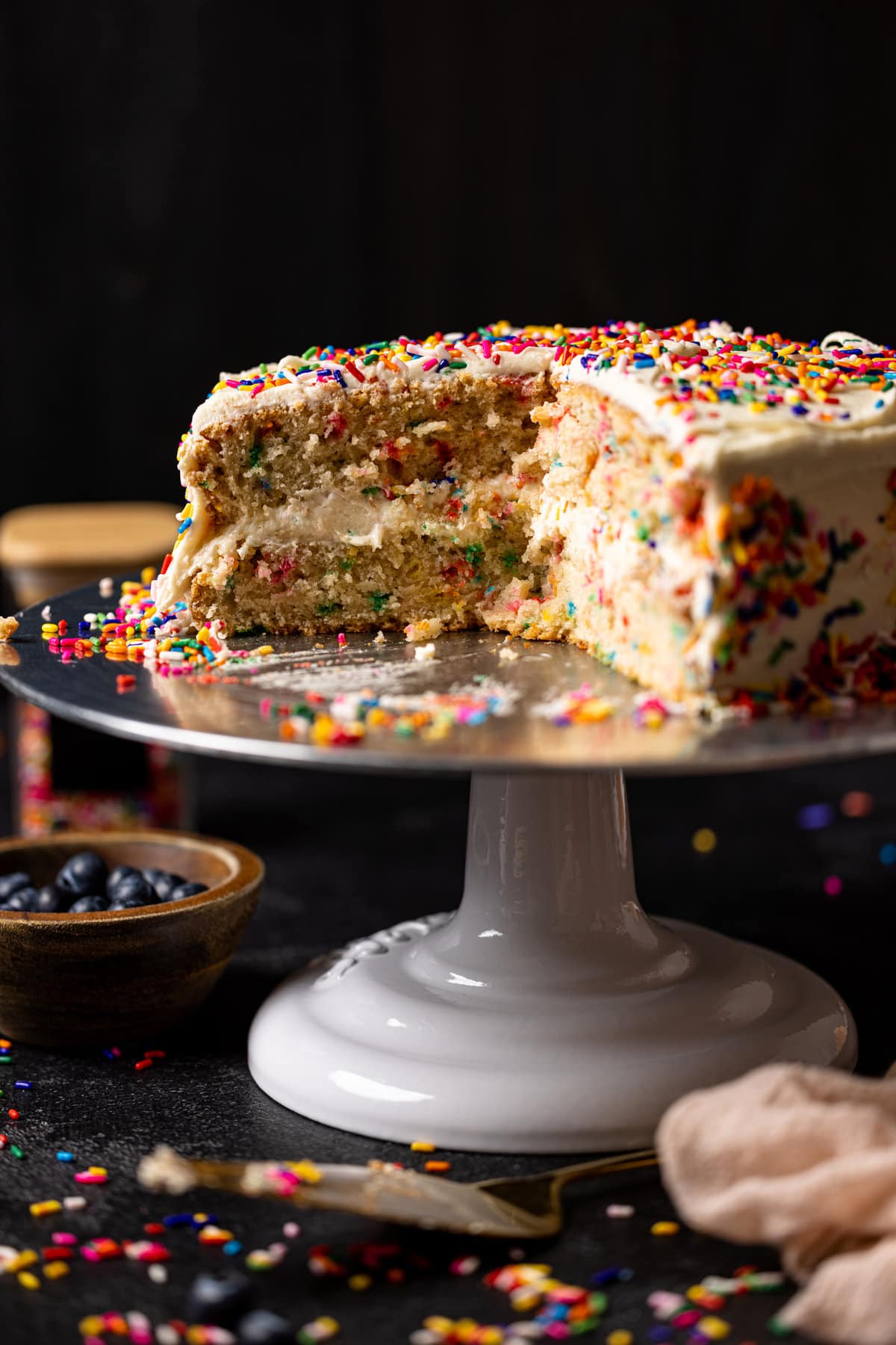 Vegan Funfetti Cake with Vanilla Buttercream missing a slice