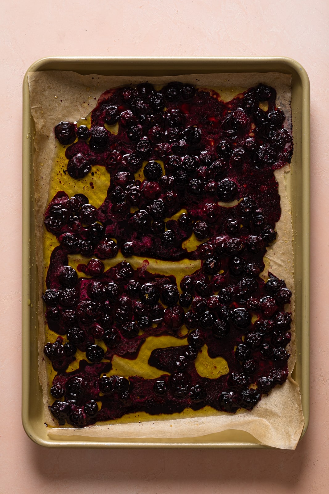 Roasted blueberries on a baking sheet