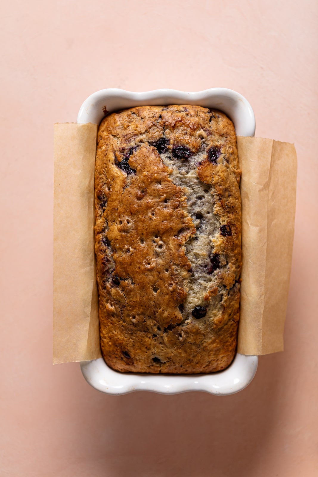 Loaf of Roasted Blueberry Lemon Olive Oil Bread in a bread pan