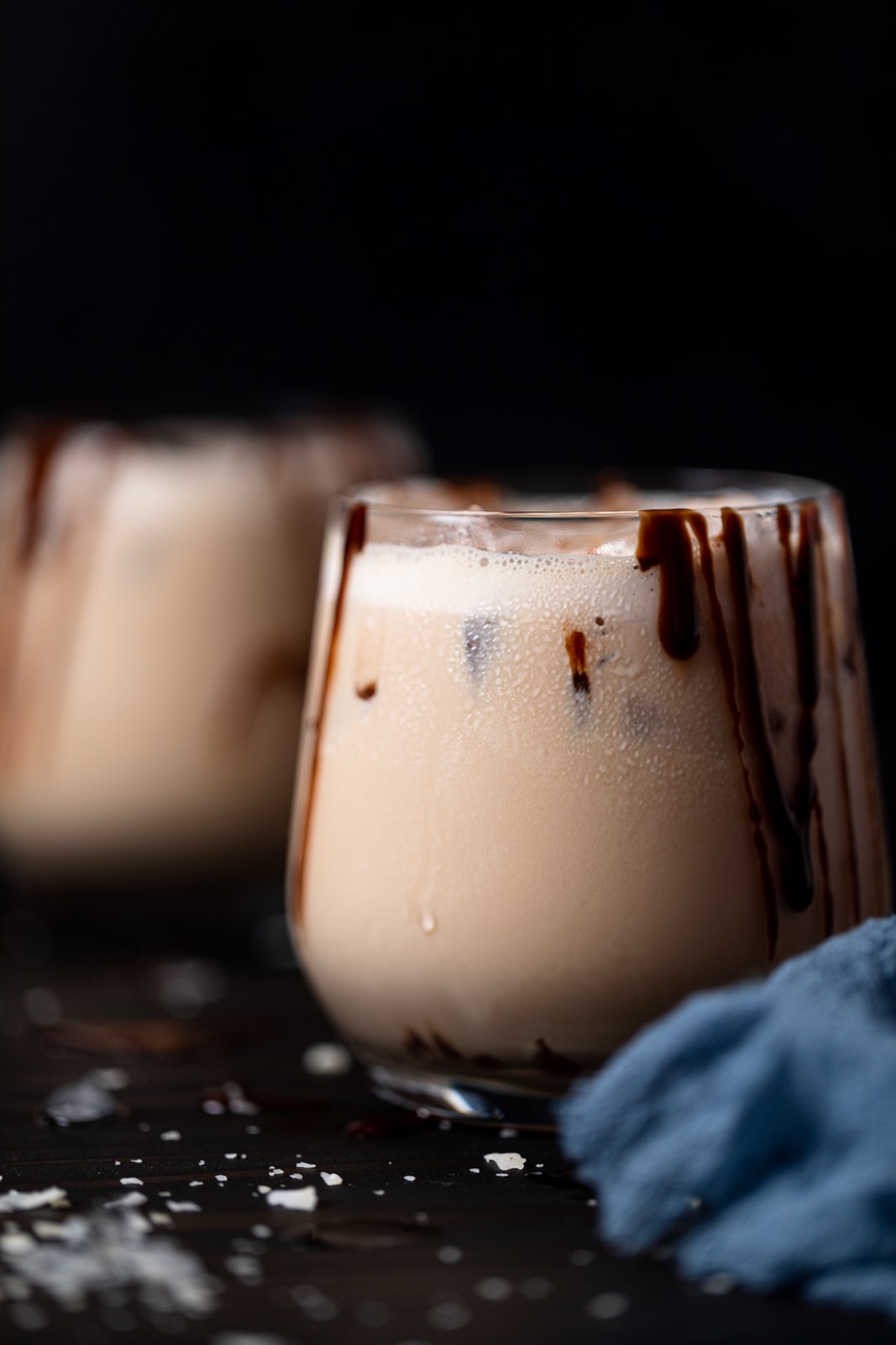 Glass of alcohol-free Jamaican Rum Cream with chocolate dripping down the side
