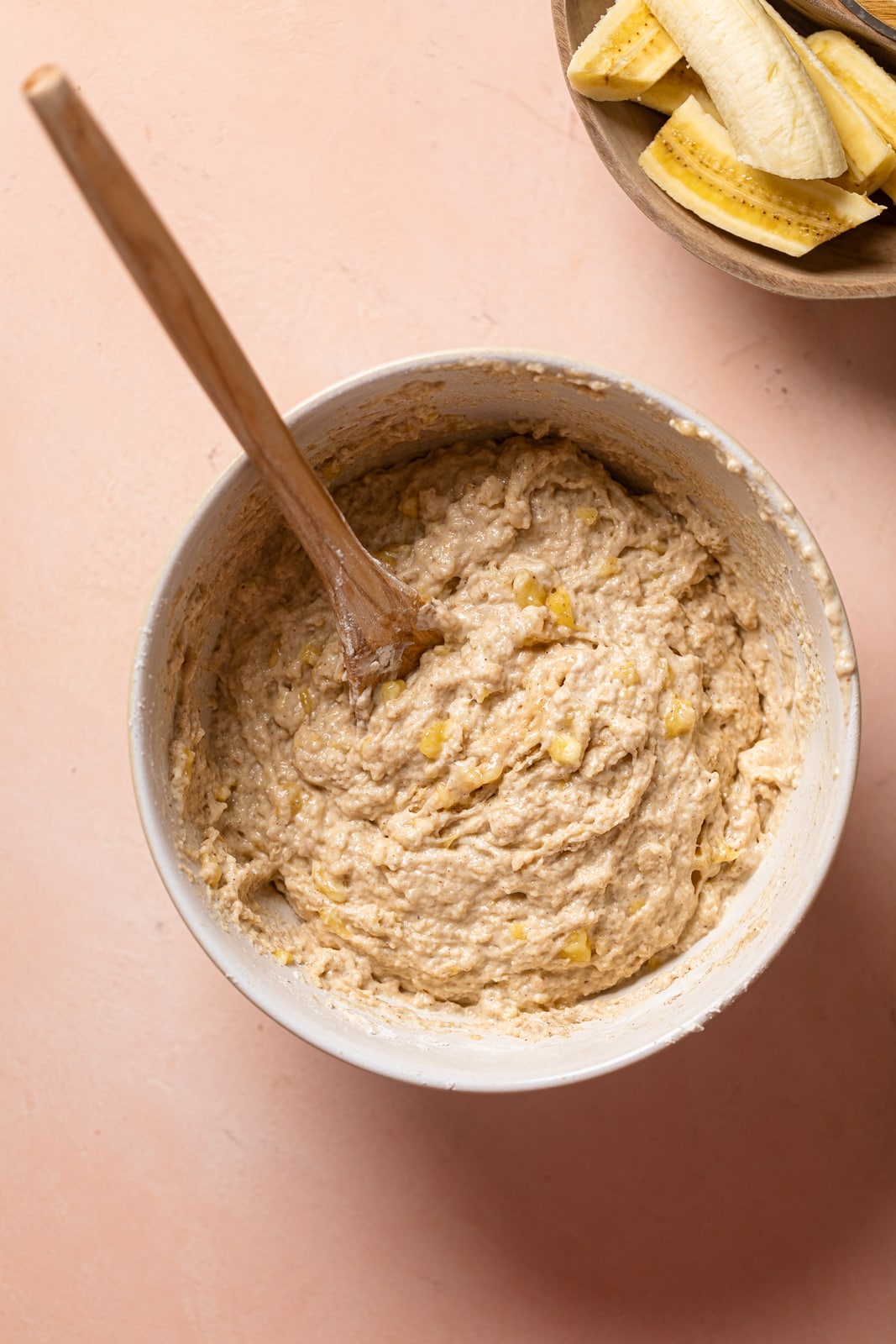 Wooden spoon in a bowl of Banana Bread dough