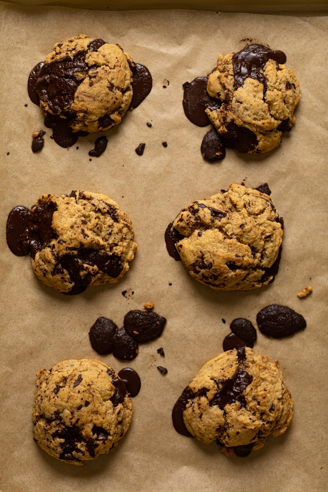 Big Brown Butter Chocolate Chip Cookies on parchment paper