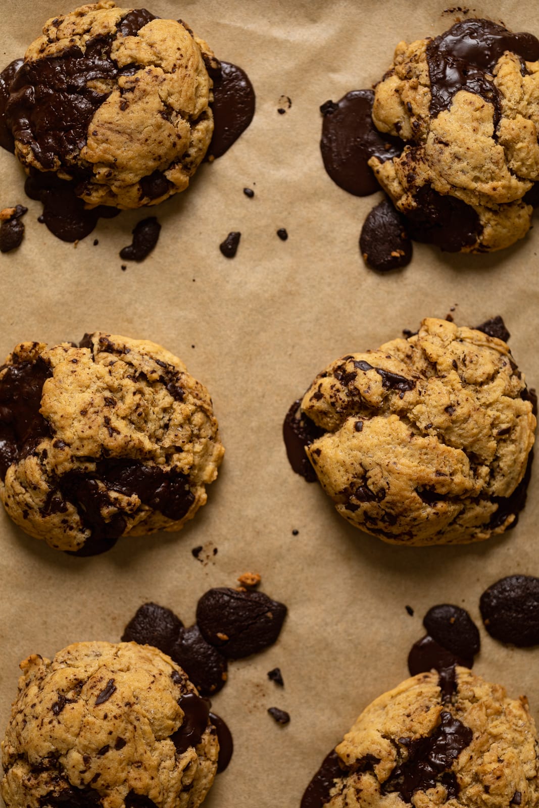 Closeup of Big Brown Butter Chocolate Chip Cookies on parchment paper