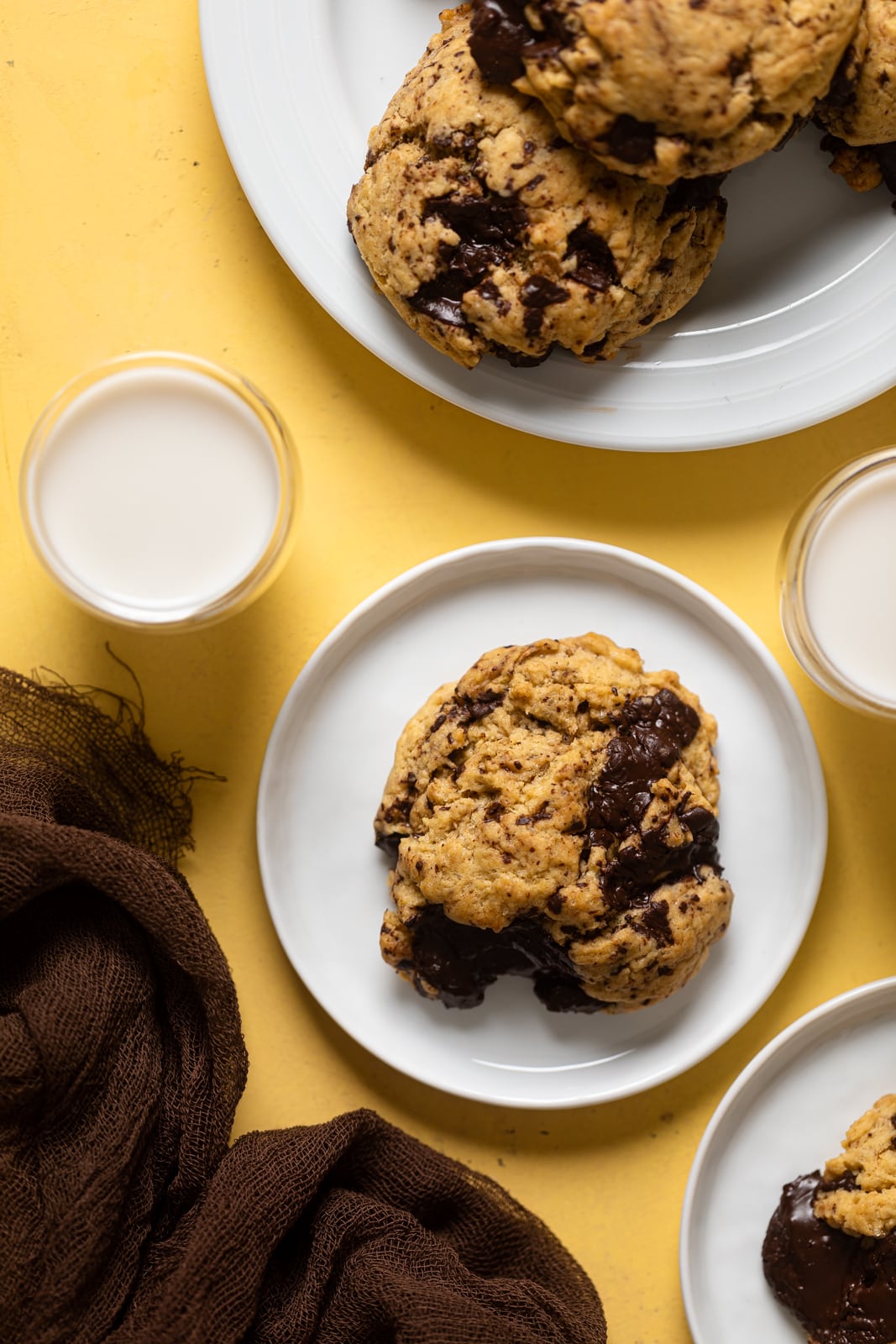 Overhead shot of Big Brown Butter Chocolate Chip Cookies on plates