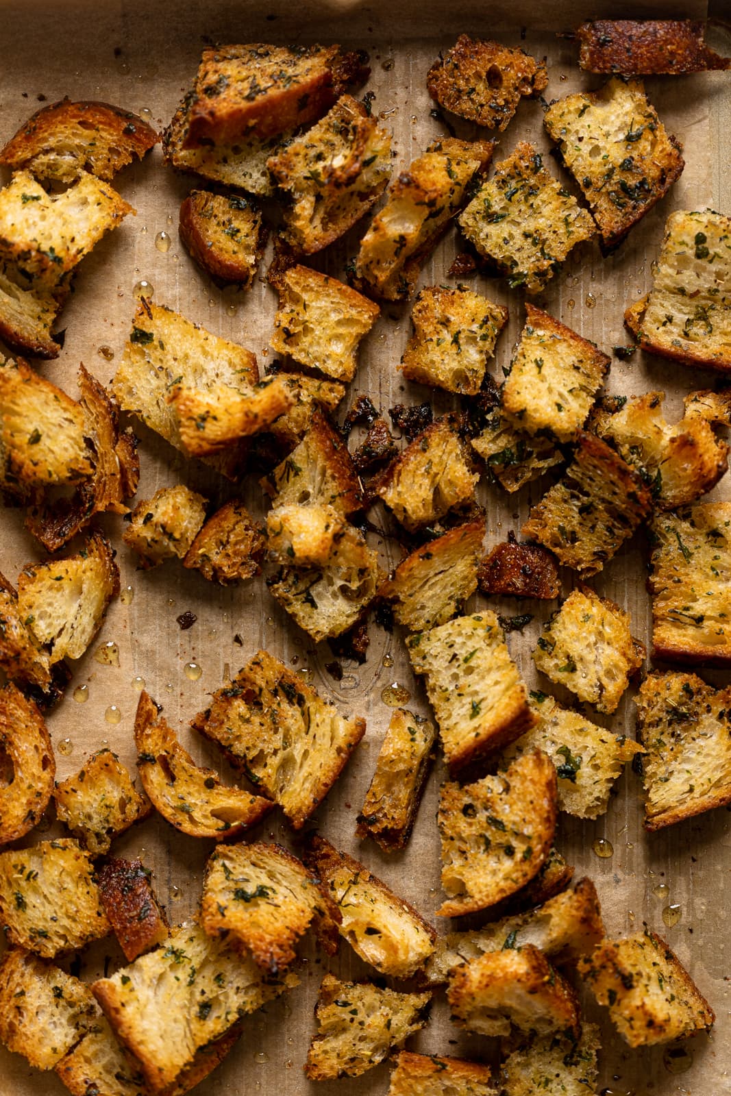 Closeup of homemade croutons on parchment paper