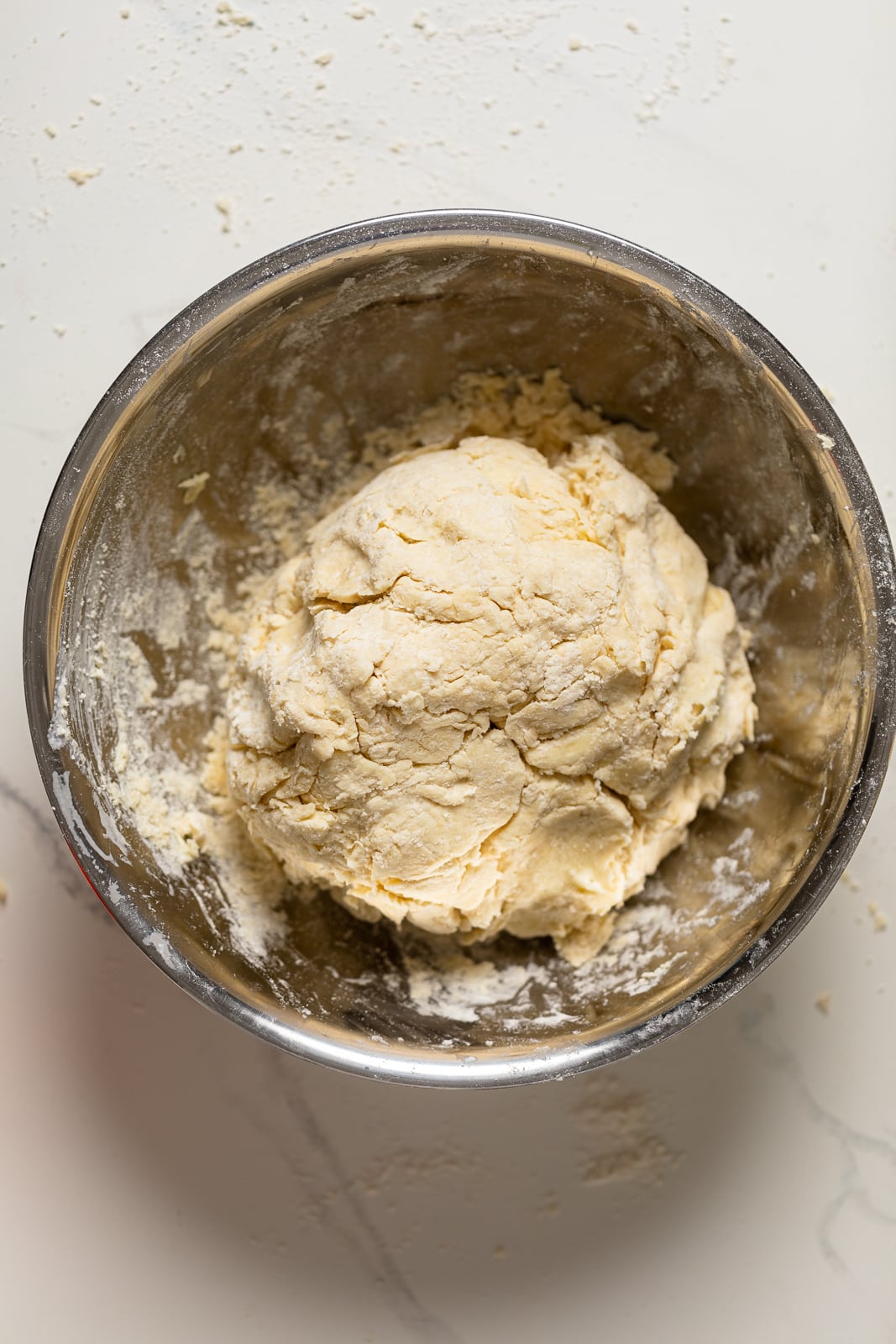 Ball of Flaky Honey Buttermilk Biscuit dough in a bowl