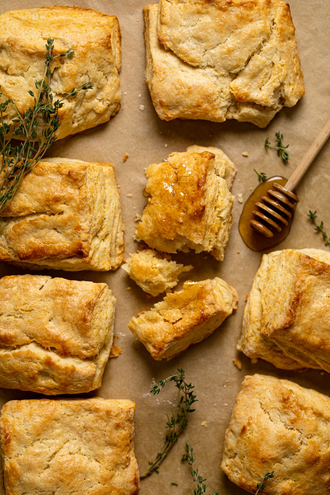 Flaky Honey Buttermilk Biscuits on parchment paper