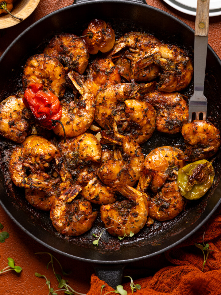 Jamaican Pepper Shrimp in a black skillet with a fork.