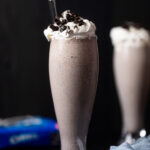 Tall glass filled with an Oreo Milkshake
