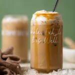 Peanut Butter Caramel Iced Latte in a glass with script that reads "Inhale. Exhale. It is Well."