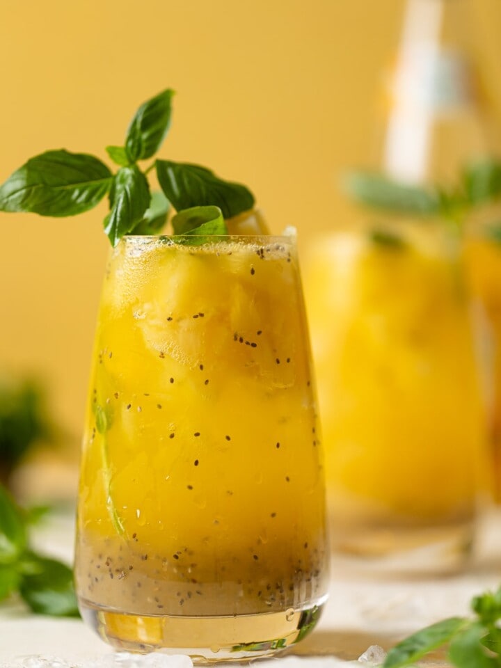 Glass of bright yellow Pineapple Chia Seed Tropical Mocktail