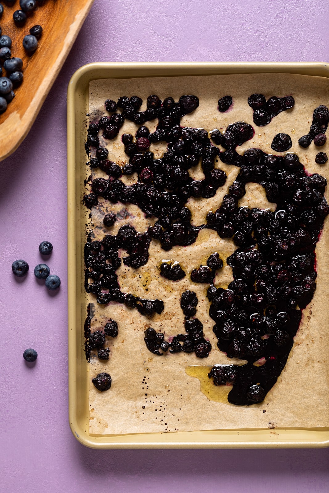 Roasted blueberries on a baking sheet